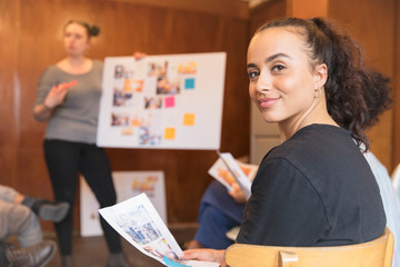 Portrait confident creative female designer in meeting