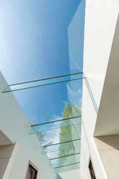 Modern Glass Skylight Below Sunny Blue Sky