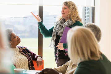 Businesswoman leading conference room meeting
