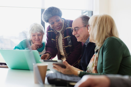 Senior business people talking in conference room meeting