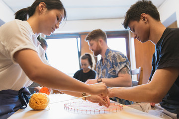 People making string art project