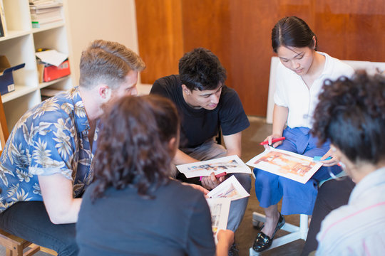 Creative designers reviewing proofs