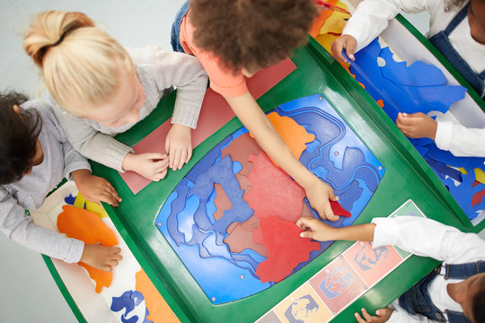 View from above kids playing at interactive exhibit in science center