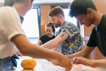 People doing string art craft