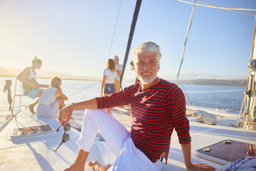 Portrait smiling man relaxing on sunny boat