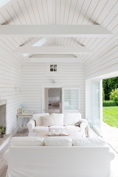 White wood shiplap a-frame home showcase living room