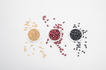 Various kinds of beans on white background