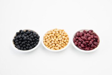 Various kinds of beans on white background
