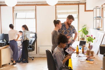Creative designers brainstorming, planning in office