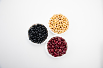 Various kinds of beans on white background