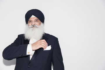 Portrait confident senior man with white beard wearing turban