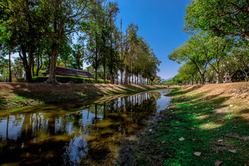 Background, the landmark of the Buddhist tourist attraction in Sukhothai Historical Park, tourists all over the world come to see the beauty always in Thailand.