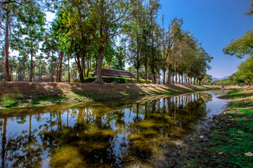 Background, the landmark of the Buddhist tourist attraction in Sukhothai Historical Park, tourists all over the world come to see the beauty always in Thailand.