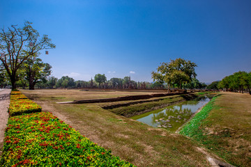 Background, the landmark of the Buddhist tourist attraction in Sukhothai Historical Park, tourists all over the world come to see the beauty always in Thailand.