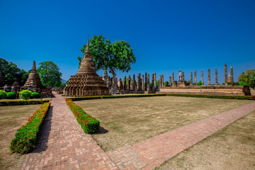 Background, the landmark of the Buddhist tourist attraction in Sukhothai Historical Park, tourists all over the world come to see the beauty always in Thailand.