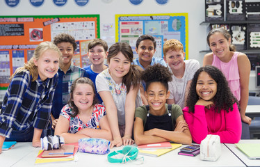 Portrait confident junior high school students in classroom