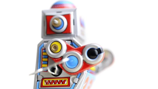 Side view of a walking wind-up tin Robot toy