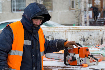 Portrait of installer in orange reflective vest