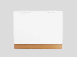 Empty white and brown desktop calendar isolated on grey background.