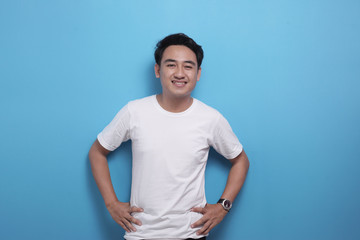 White shirt template, male model wearing white shirt against blue background