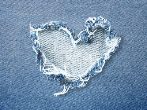 Heart shape ripped jean denim texture