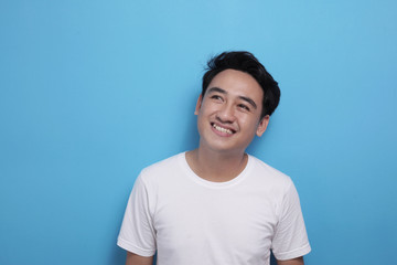 Asian man thinking something, looking for good idea