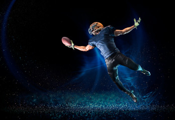 Football player reaching to catch football