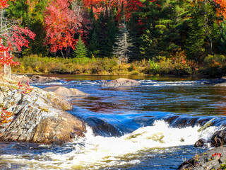Gushing river decorated by the colors of fall, Chutes Prov Park, ON, Canada