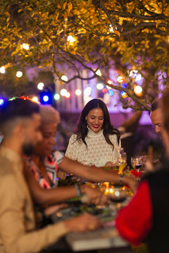 Friends enjoying dinner garden party
