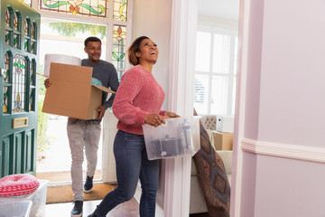 Happy couple moving into new house