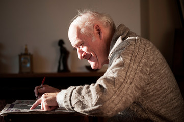Senior man reading newspaper