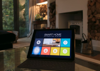 Smart home automation system on digital tablet in living room