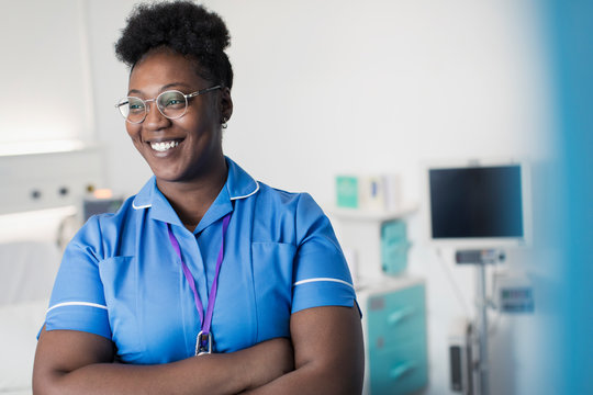 Portrait confident, smiling female nurse in in hospital room