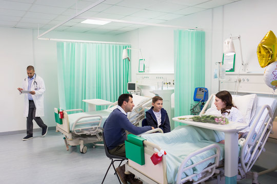 Family visiting patient in hospital ward