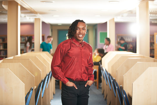 Portrait confident young male college student in computer lab