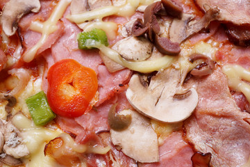 Close up of fresh baked pizza with prosciutto and bacon