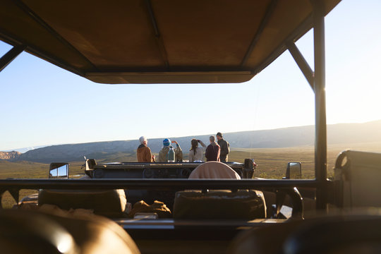 Safari tour group looking at view off-road vehicle South Africa