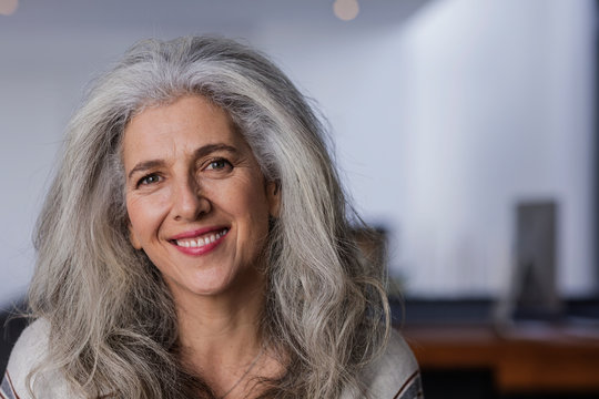 Portrait smiling mature woman with long, gray hair