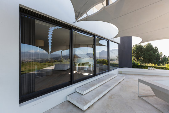 Luxury home showcase exterior patio with awning