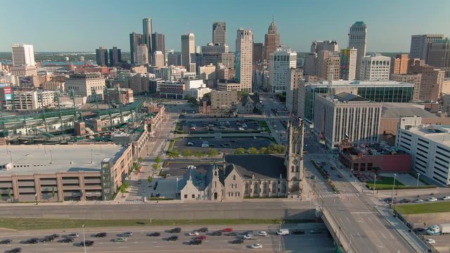 Aerial: Establishing shot of downtown Detroit and Fisher Freeway. Detroit, Michigan, USA