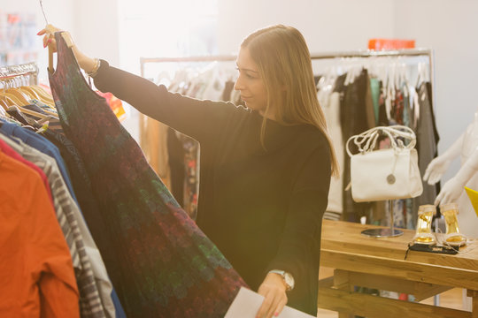 Fashion buyer examining skirt