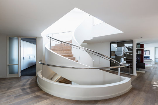 Modern spiral staircase in home showcase interior 