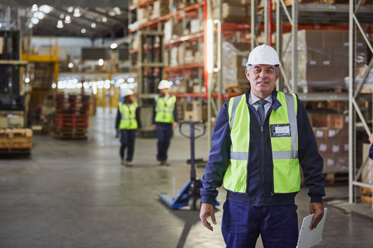Portrait confident manager in distribution warehouse