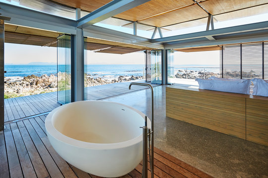 Modern luxury home showcase bathroom and sink with ocean view
