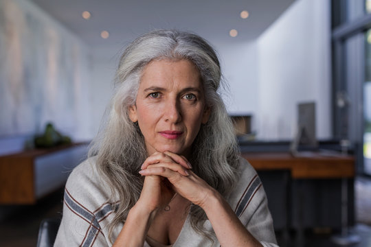 Portrait confident, serious mature woman with long, gray hair