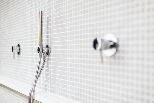 Close up modern, minimalist home showcase shower faucet