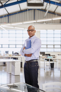 Portrait confident businessman in office