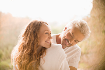 Affectionate playful couple smiling