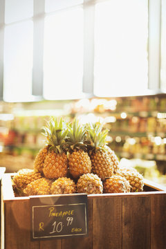 Pineapples on display in grocery store market