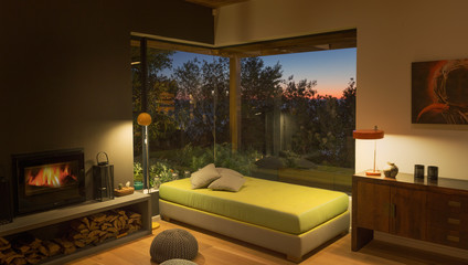 Illuminated bench seat at window in modern, luxury home showcase interior living room